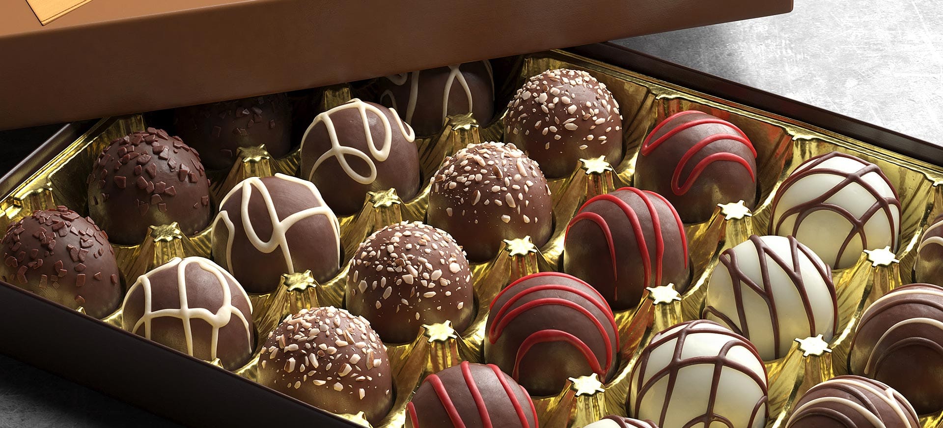 Fotorealistische 3D-Visualisierung einer Pralinenschachtel mit fein dekorierten Schokoladenkugeln